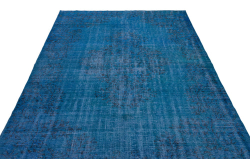 Load image 1 in gallery view. Distressed blue rug with a faded black central medallion and traditional ornate pattern on a white background.