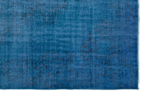 Load image 1 in gallery view. Deep blue distressed rug with a faded, abstract vintage pattern on a white background.