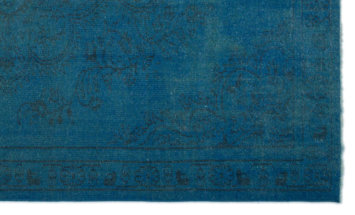 Load image 1 in gallery view. Deep blue rug with a subtle, dark-toned floral medallion pattern and a detailed border.