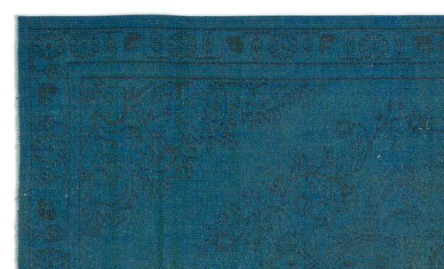 Load image 1 in gallery view. Teal rug with a dark, subtle floral border and intricate tonal pattern.