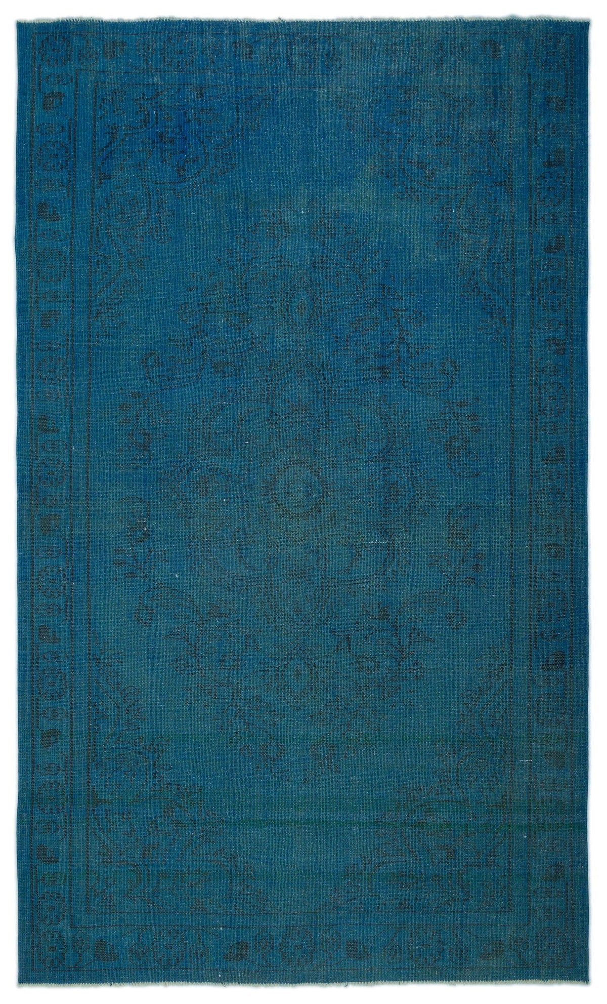 Monochromatic blue rug with a faint, distressed traditional medallion pattern and a thin border.
