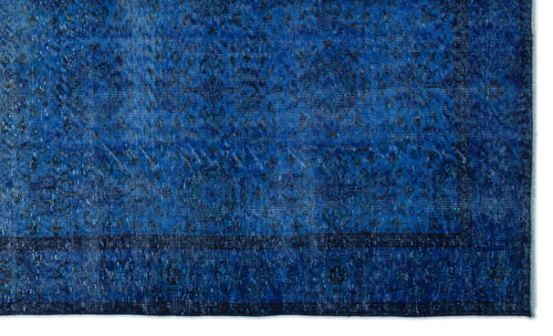Load image 1 in gallery view. Deep blue distressed rug with a faded traditional medallion pattern and a dark border.