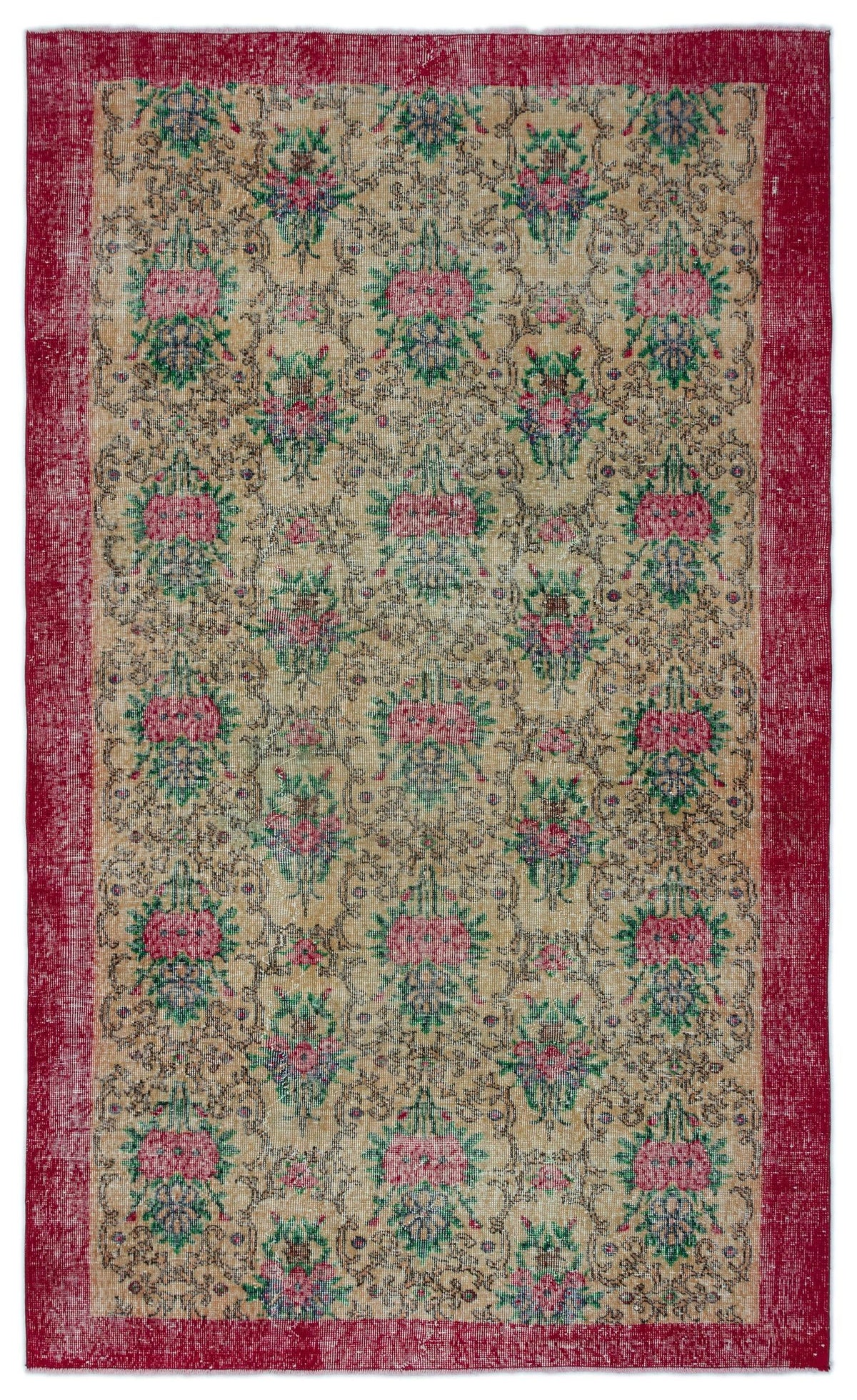 Tan vintage-style rug with a repeating floral medallion pattern in pink and green, framed by a solid red border.