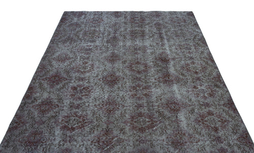 Load image 1 in gallery view. Distressed charcoal and burgundy rug with a repeating traditional medallion pattern on a white background.