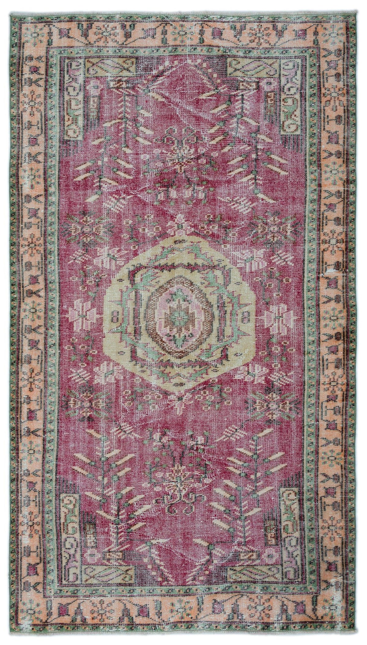 Magenta and cream vintage-style rug with a central medallion, geometric floral motifs, and a distressed finish.