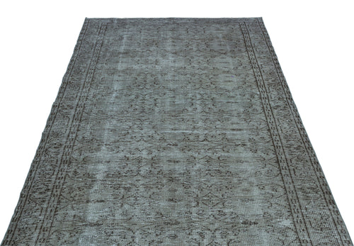 Load image 1 in gallery view. Grey and brown vintage-style rug with a distressed traditional medallion pattern and a bordered edge.
