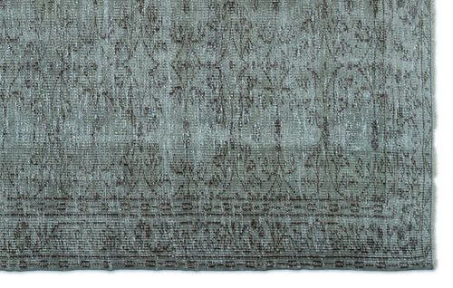 Load image 1 in gallery view. Sage green and brown distressed rug with a faded traditional floral pattern and a bordered edge.