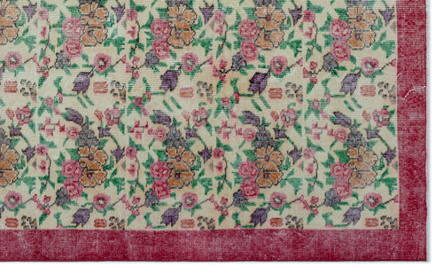 Load image 1 in gallery view. Cream rug with a multi-colored floral pattern in pink, orange, and purple, framed by a solid red border.
