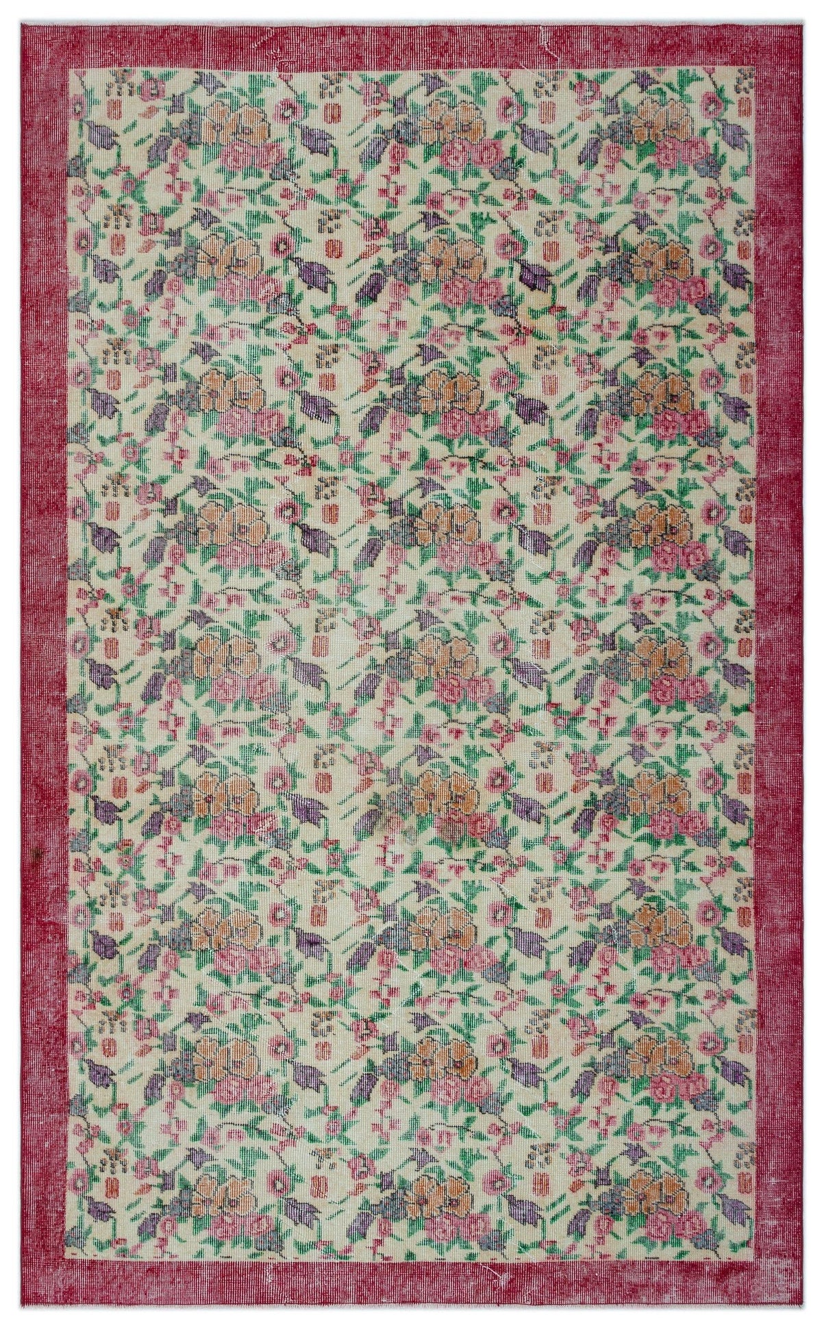 Cream rug with a red border and a repeating floral pattern in pink, orange, and purple on a white background.