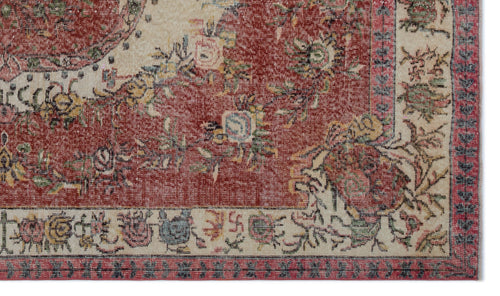 Load image 1 in gallery view. Distressed red and cream traditional rug with a floral medallion pattern and a decorative border.