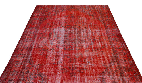 Load image 1 in gallery view. Distressed red vintage-style rug with a faded central medallion and dark grey intricate patterns.