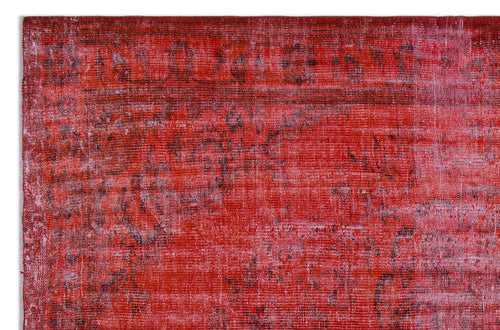 Load image 1 in gallery view. Distressed red and dark pink rug with a faded traditional floral medallion pattern.