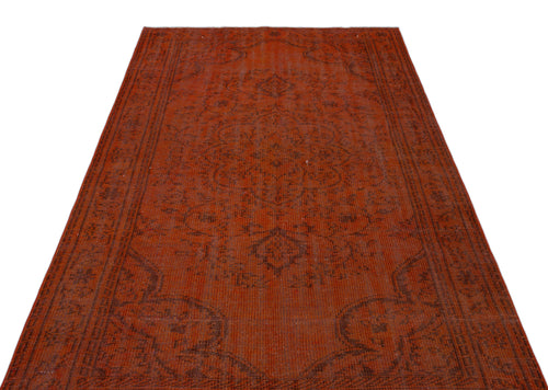Load image 1 in gallery view. Rust-colored vintage-style rug with a dark brown central medallion and intricate floral border on a white background.