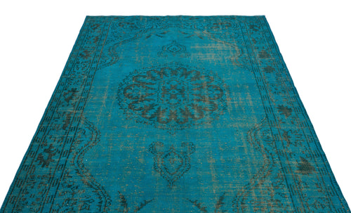 Load image 1 in gallery view. Teal vintage-style rug with a distressed black central medallion and ornate border pattern on a white background.