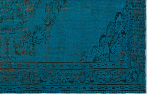 Load image 1 in gallery view. Teal rug with a dark, distressed traditional floral medallion pattern and a geometric border.