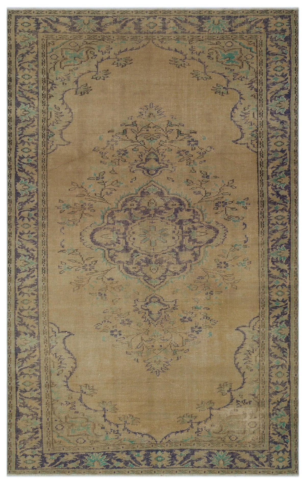 Tan vintage-style rug with a central dark blue and teal floral medallion and a decorative border.