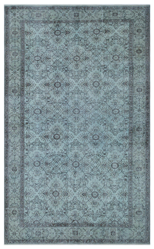 Load image 1 in gallery view. Light blue and charcoal grey traditional rug with a distressed floral medallion pattern and a bordered edge.