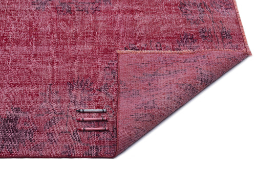 Load image 1 in gallery view. Distressed magenta and dark purple vintage-style rug with a folded corner, shown with three color reference crayons.