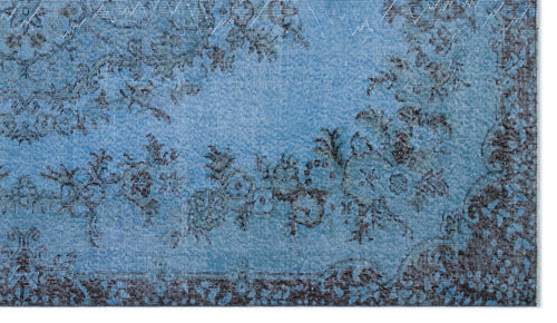 Load image 1 in gallery view. Bright blue rug with a distressed black floral pattern and a dark border.