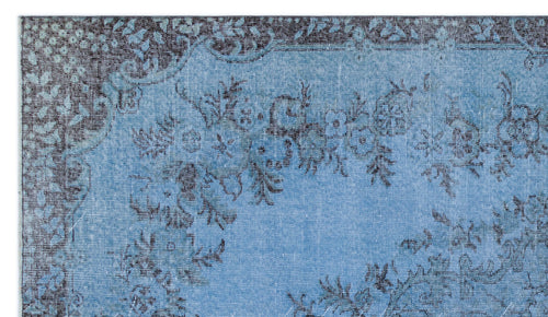 Load image 1 in gallery view. Light blue and charcoal grey rug with a distressed floral medallion pattern and a decorative border.
