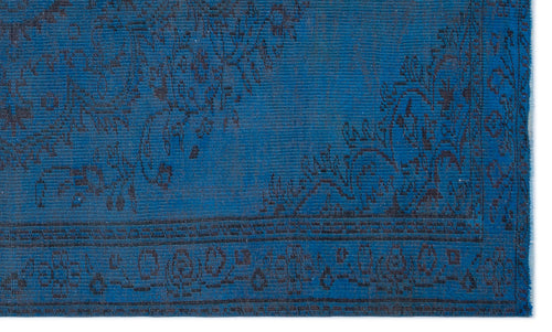 Load image 1 in gallery view. Deep blue rug with a dark charcoal traditional floral medallion pattern and a geometric border.