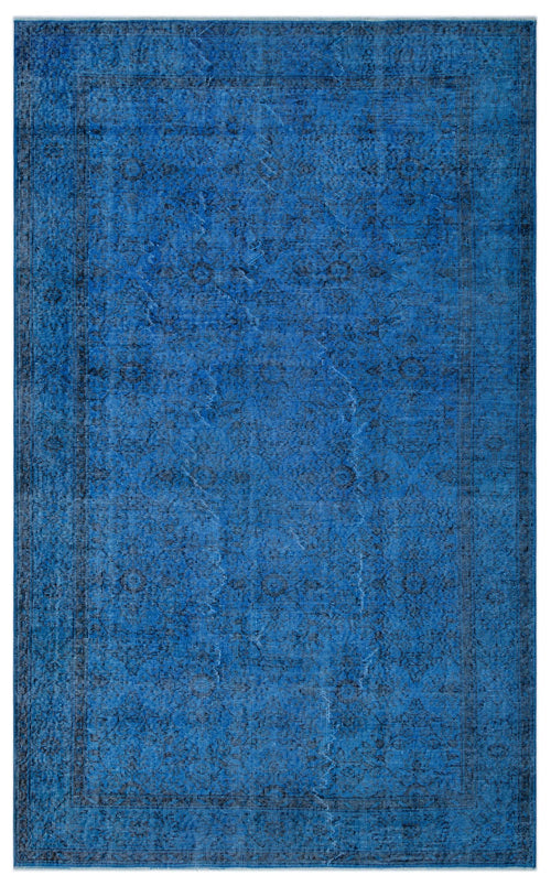 Load image 1 in gallery view. Monochromatic blue rug with a distressed traditional medallion pattern and a dark border.