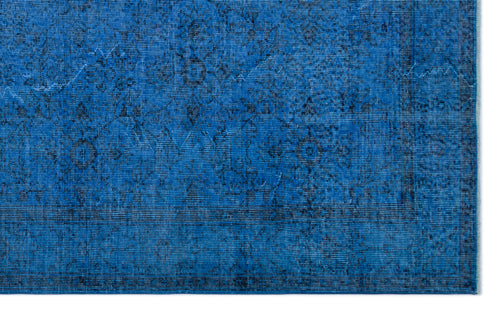 Load image 1 in gallery view. Vibrant blue rug with a distressed, dark-toned traditional floral medallion pattern and a bordered edge.