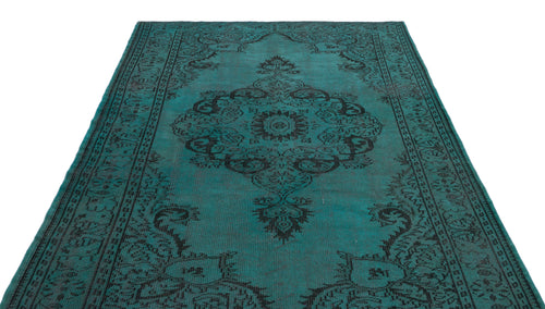 Load image 1 in gallery view. Teal and black distressed rug with a traditional central medallion and ornate border pattern.