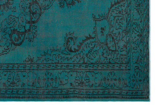 Load image 1 in gallery view. Teal rug with a black distressed floral medallion pattern and a decorative border.