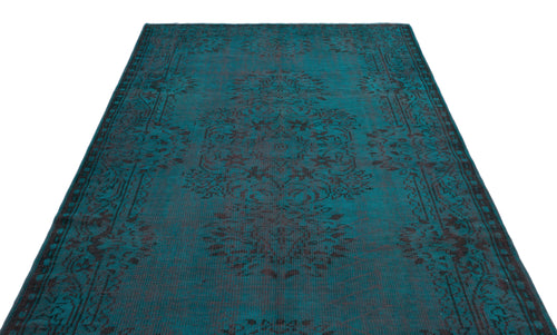 Load image 1 in gallery view. Teal and black distressed rug with a traditional central medallion and ornate border on a white background.