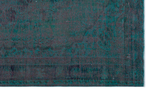 Load image 1 in gallery view. Teal and dark purple distressed rug with a faded traditional medallion pattern on a white background.