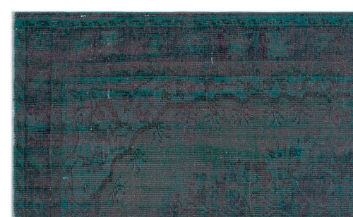 Load image 1 in gallery view. Teal and dark purple vintage-style rug with a distressed, faded traditional border and central pattern.