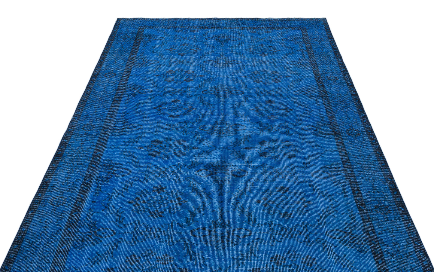 Vibrant blue rug with a dark, distressed traditional floral medallion pattern and a bordered edge on a white background.