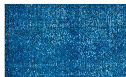 Load image 1 in gallery view. Deep blue distressed rug with a faint, traditional medallion pattern and a thin border.