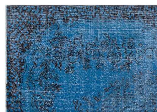 Load image 1 in gallery view. Bright blue rug with a distressed black floral medallion pattern and a dark border.