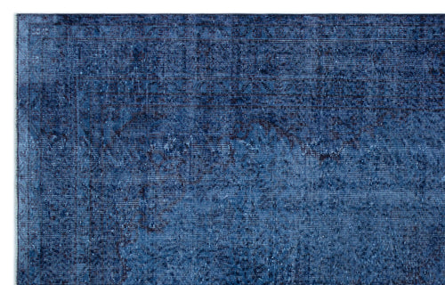 Load image 1 in gallery view. Deep blue distressed rug with a faint, traditional Persian-style medallion pattern.