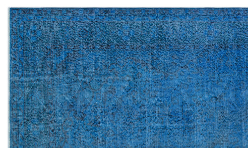 Load image 1 in gallery view. Bright blue distressed rug with a subtle geometric diamond pattern and a dark border.