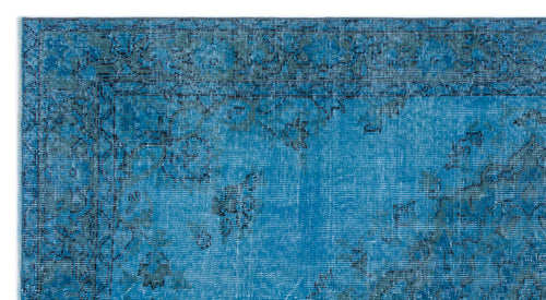 Load image 1 in gallery view. Bright blue distressed rug with a dark grey traditional floral border and faded medallion pattern.