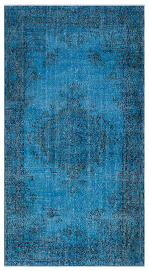 Load image 1 in gallery view. Bright blue distressed rug with a dark grey traditional floral medallion and border pattern on a white background.