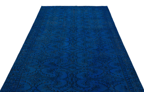 Load image 1 in gallery view. Deep blue vintage-style rug with a black distressed floral medallion pattern on a white background.