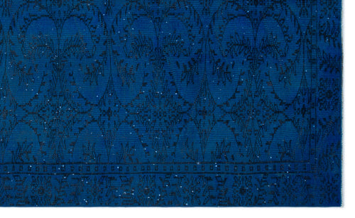 Load image 1 in gallery view. Deep blue rug with a black ornate floral medallion pattern and a decorative border.