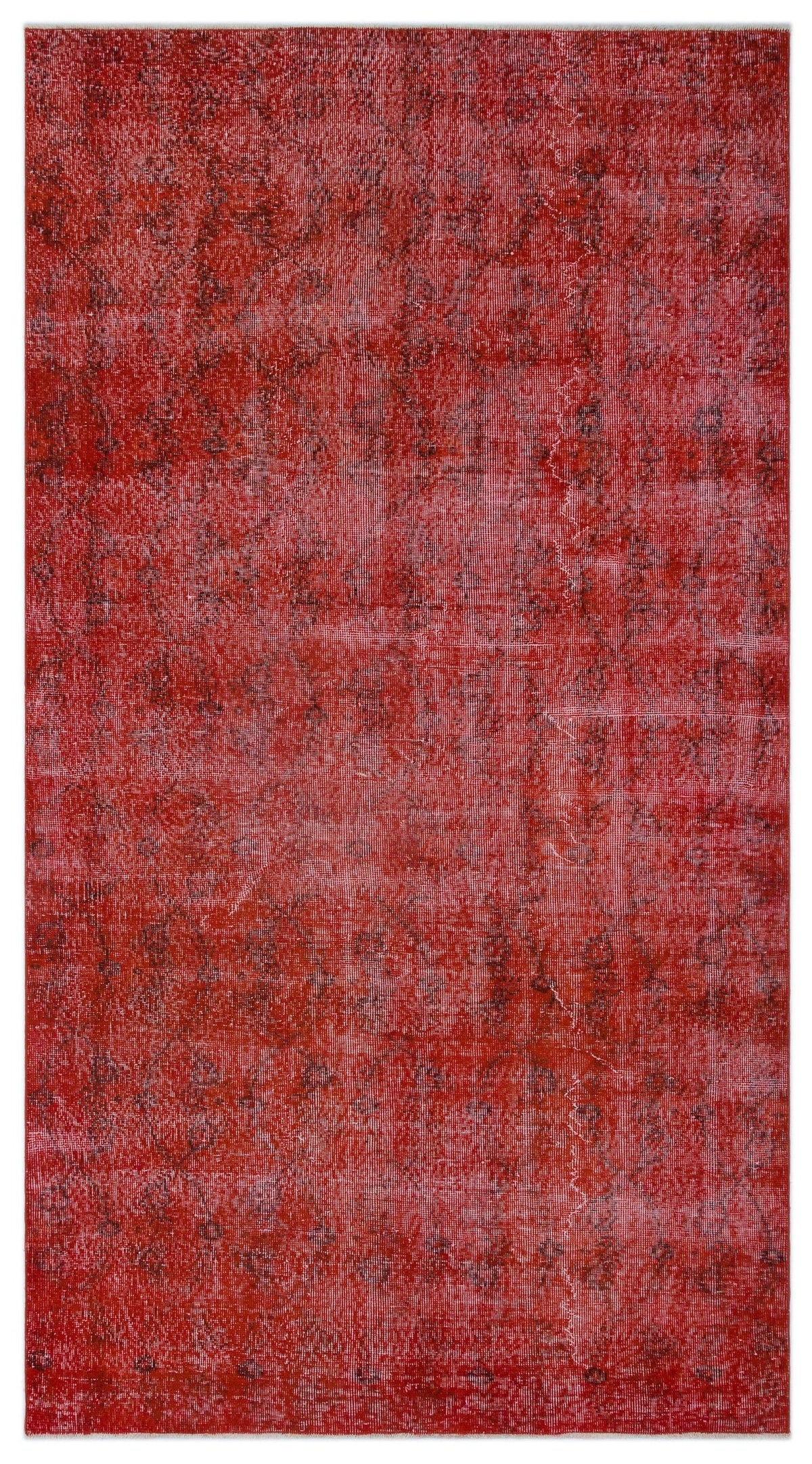 Solid red vintage-style rug with a faint, distressed dark grey floral medallion pattern.
