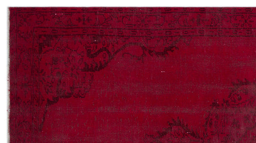 Load image 1 in gallery view. Deep red rug with a black distressed floral medallion pattern and a geometric border.