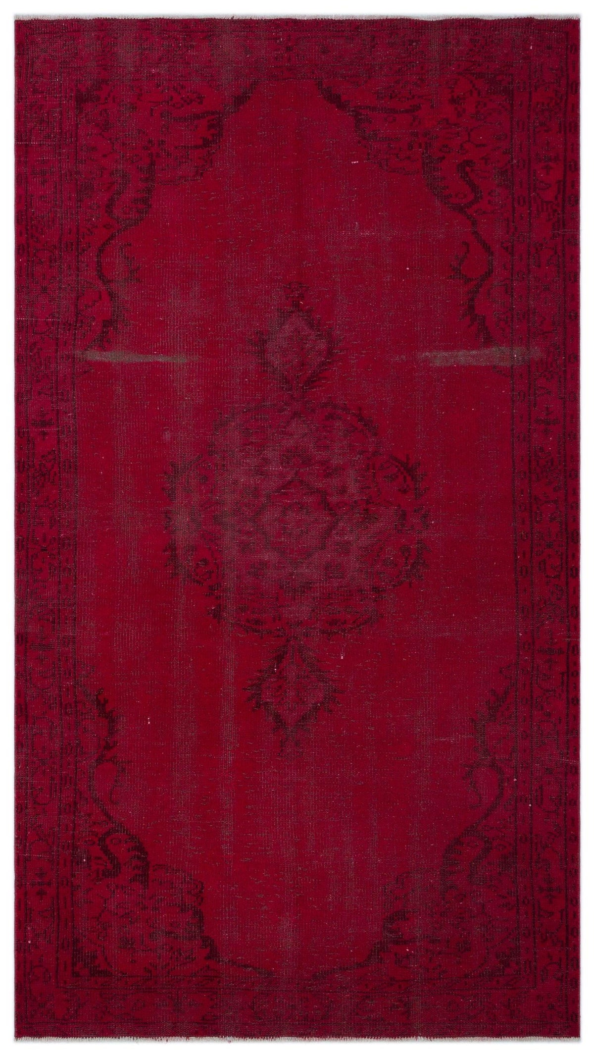 Deep red vintage-style rug with a faded black central medallion and ornate border pattern.