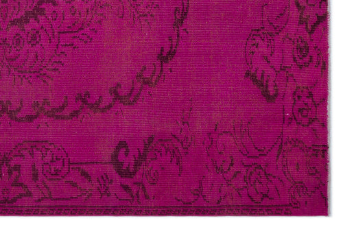 Load image 1 in gallery view. Magenta rug with a dark, distressed floral medallion pattern and a textured, woven finish.