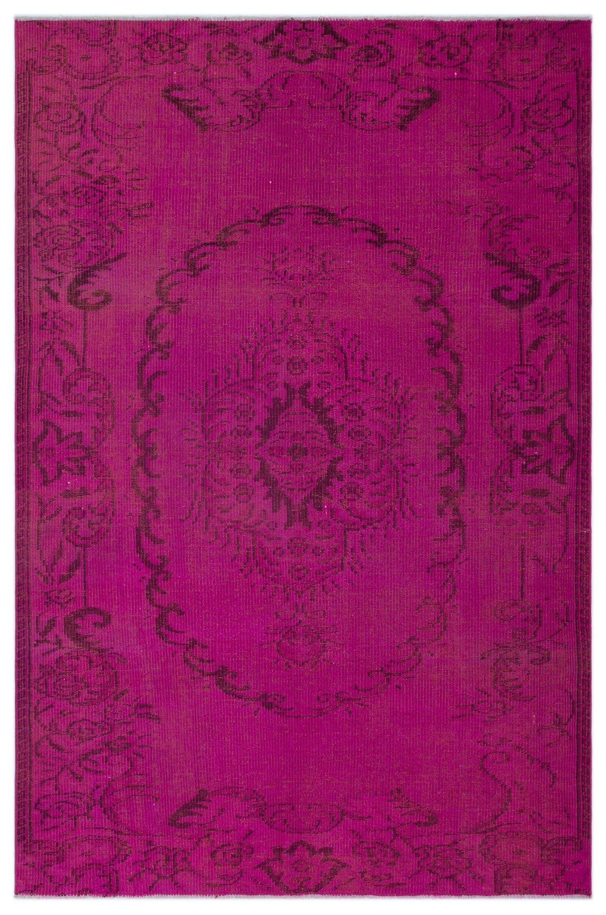 Magenta rug with a dark purple distressed floral medallion pattern and ornate border on a white background.