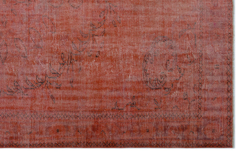 Load image 1 in gallery view. Terracotta and faded red vintage-style rug with a distressed floral medallion pattern and a thin geometric border.