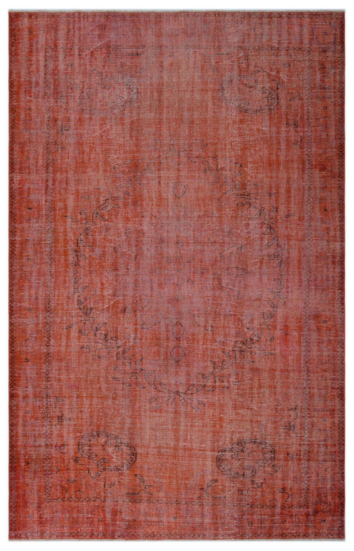 Terracotta red vintage-style rug with a faded, distressed medallion pattern and dark grey linear border details.