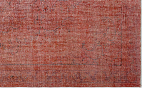 Load image 1 in gallery view. Distressed terracotta red rug with a faint, faded traditional floral pattern and a dark border.