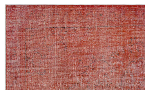 Load image 1 in gallery view. Distressed terracotta red rug with a faint, faded black traditional medallion pattern.